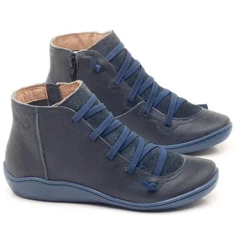 Women's casual flat booties with a wedge heel and round toe in various colours.