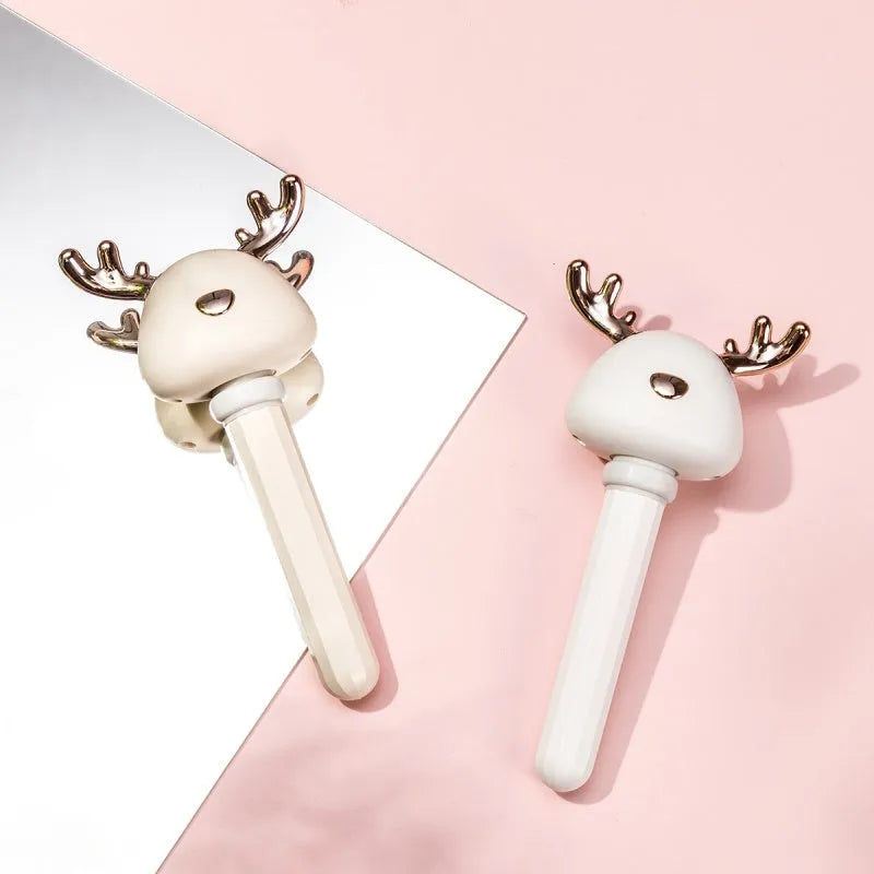 Mini USB portable car humidifier with creative little antler design in beige, showing water tank filler and USB cable