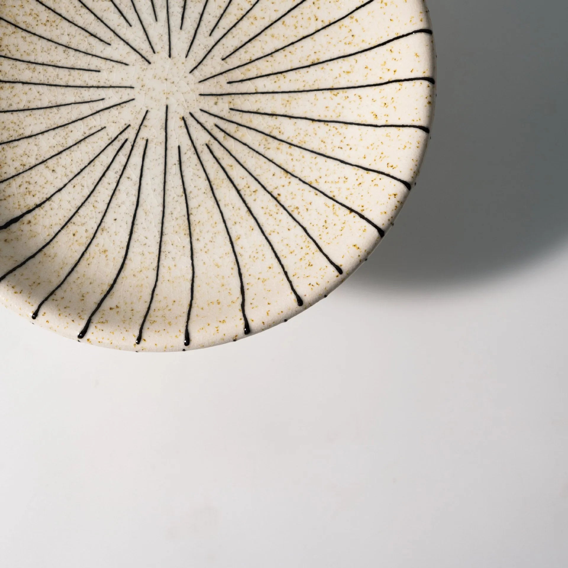 Black and white striped retro resin fruit plate on a table.