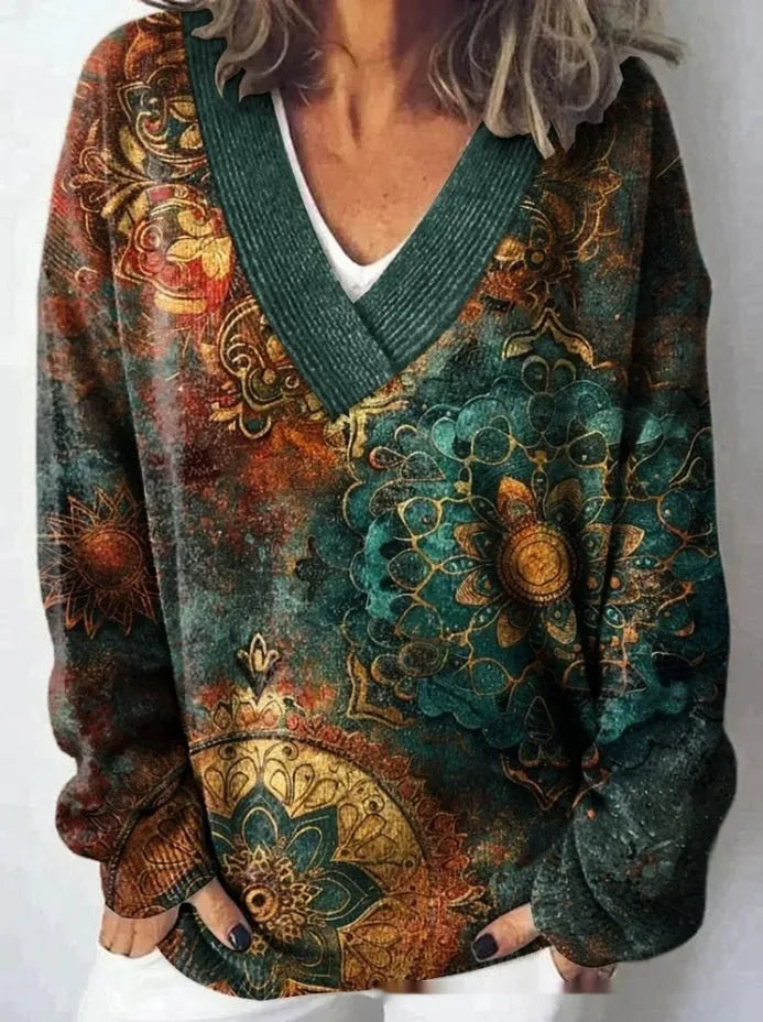 Women's grey V-neck sweatshirt with a white 3D floral pattern print and long sleeves.