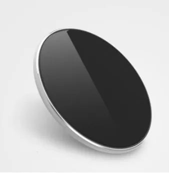 Ultra-thin aluminum wireless charger in silver colour showing charging indicator light