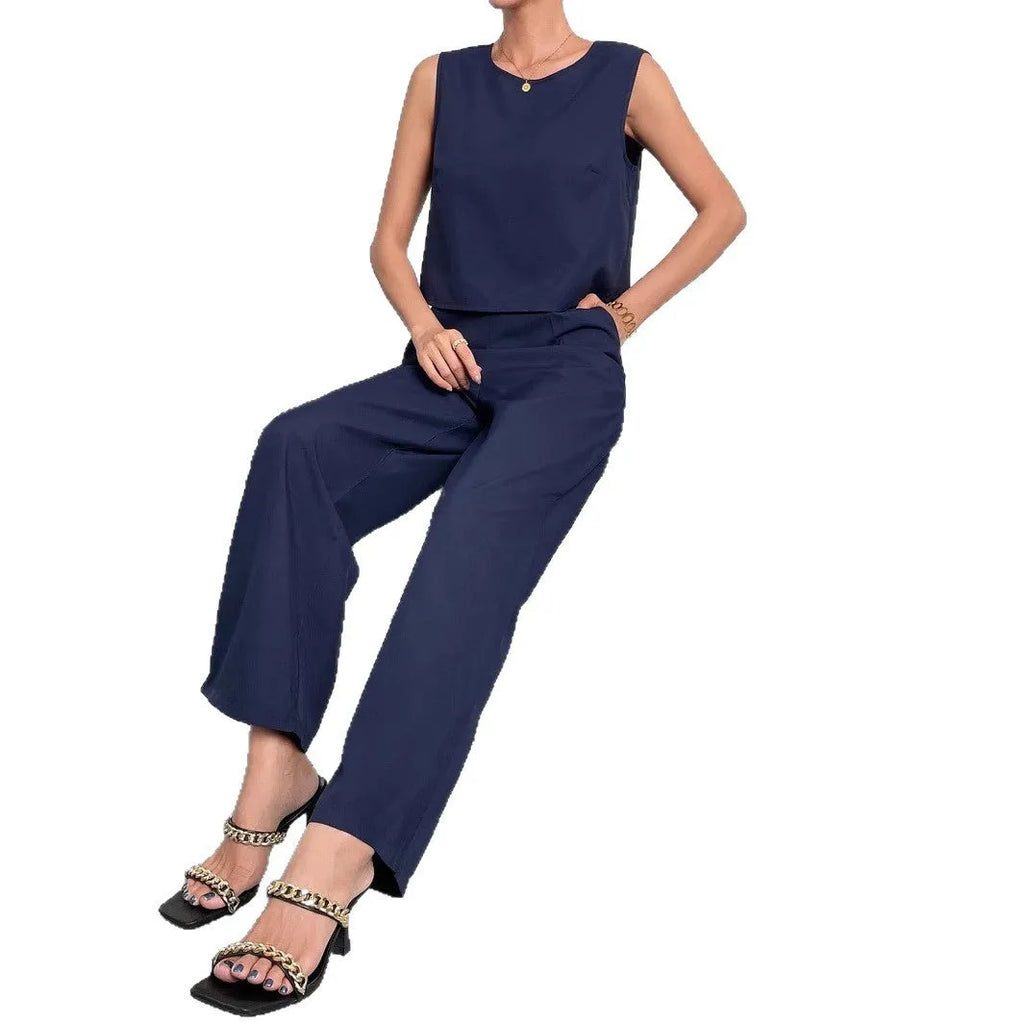 Red women's sleeveless top and wide leg pants two-piece co-ord set on a hanger.