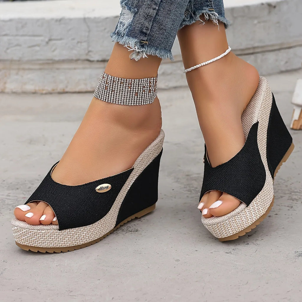Women's black wedge sandals with buckle details, first layer cowhide upper, leather lining, and cloth sole on white background