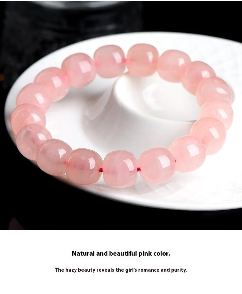 Natural crystal barrel shaped bead bracelet with pink polished geometric beads