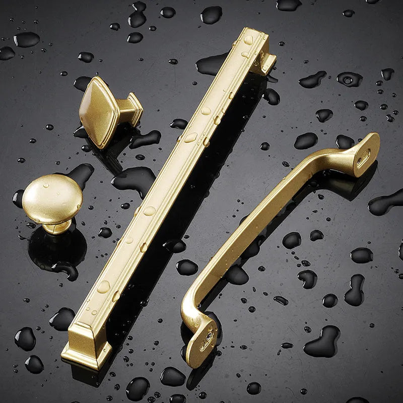 Gold T-shape single hole cabinet handle with aluminium alloy construction showing three hole distance options