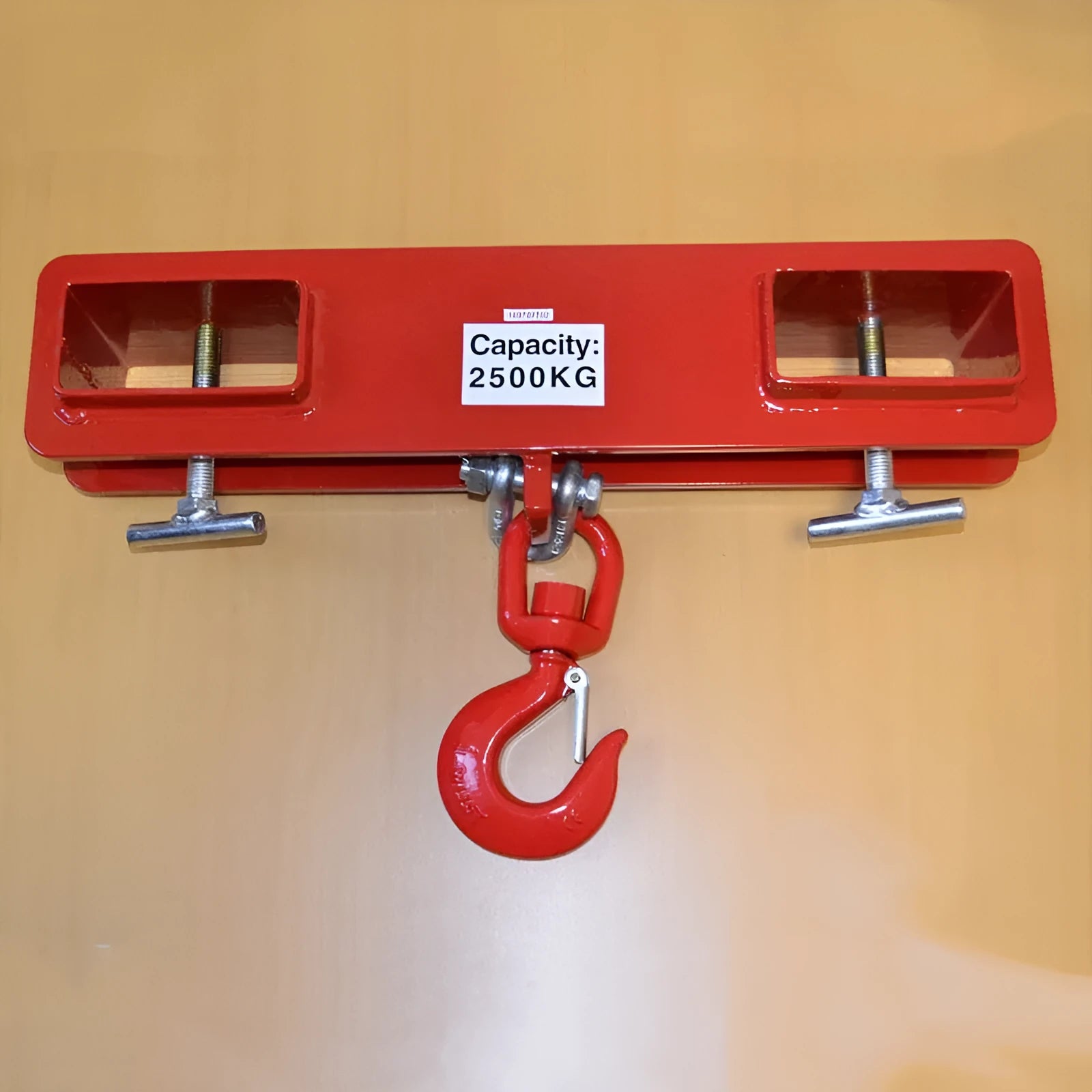 Iron forklift crane hook with rotatable head and safety lock mounted on forklift forks.