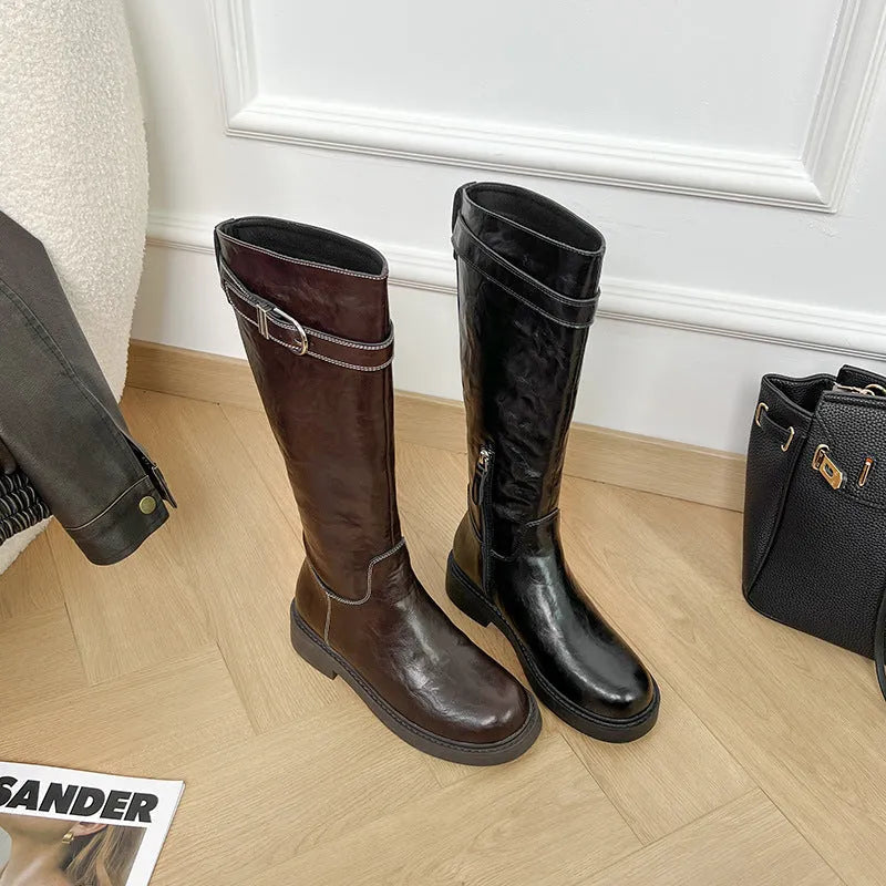 Women's knee-high black retro Martin boots with mid heel and side zipper on a white background