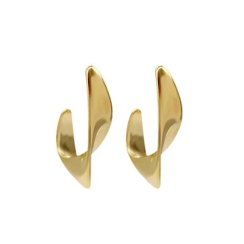 Twisted geometric metal earrings with circular elements in gold or silver electroplated finish