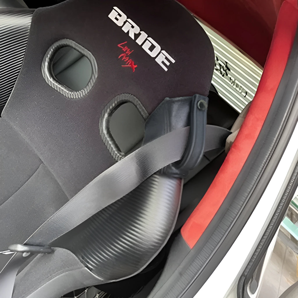 Black leather racing seat belt buckle cover measuring 30cm by 20cm for RECARO and Bride harnesses.