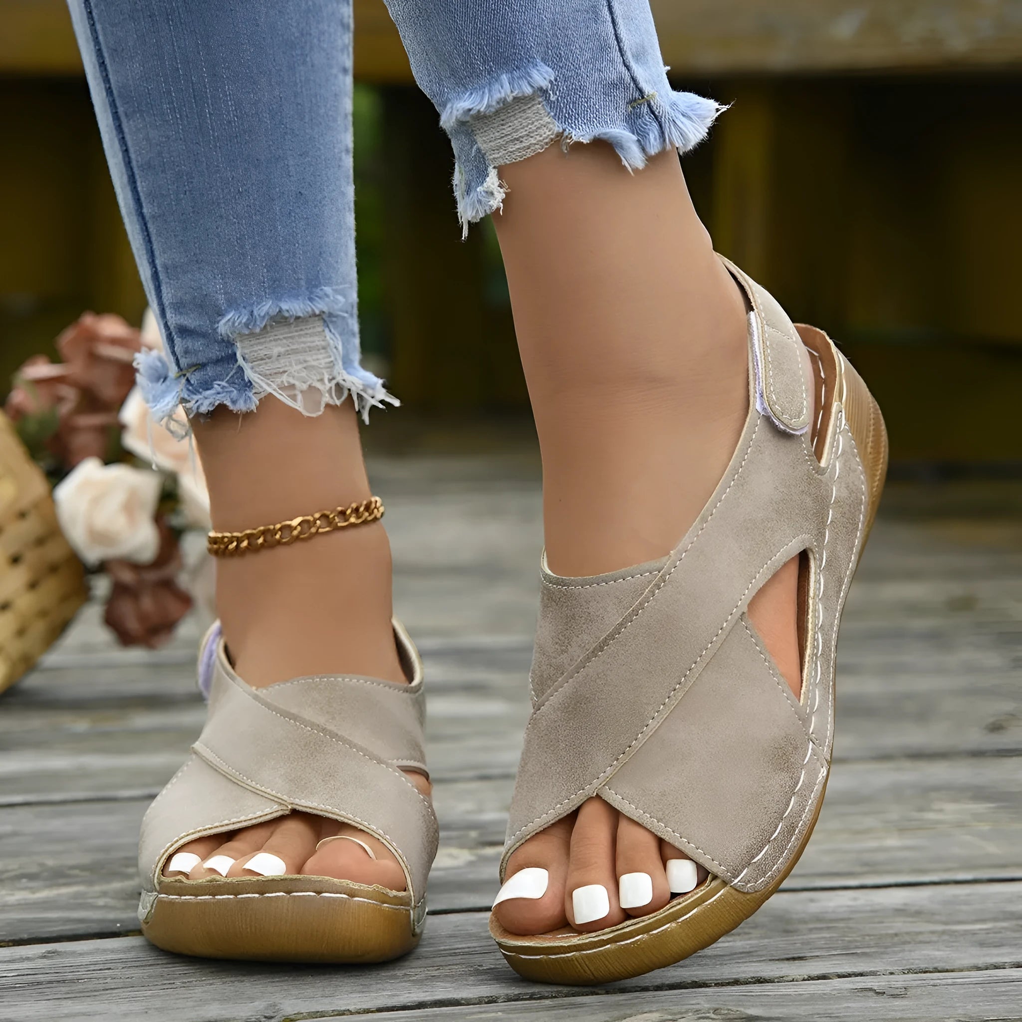 Women's brown roman platform sandals with a skirt detail and velcro strap fastening on a white background