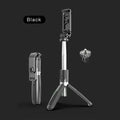 Extended black Bluetooth selfie stick with phone attached, showing wireless remote and tripod base deployed.