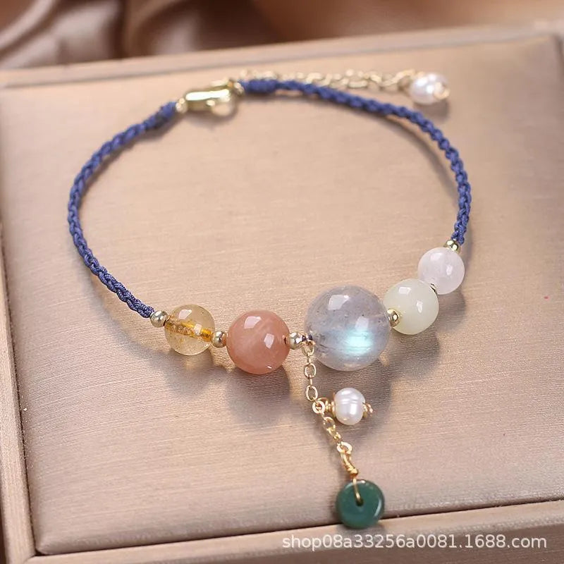Hand-woven women's bracelet with peace buckle design in crystal material with sequin detailing