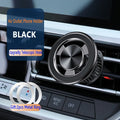 Silver air vent magnetic phone holder mounted on car dashboard with smartphone attached