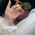 White bow pearl necklace with adjustable chain length from 31cm to 40cm