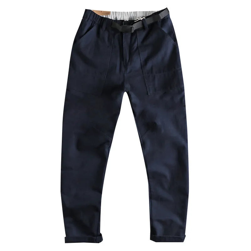 Men's khaki cotton work trousers featuring a buckle belt closure and a three-dimensional cut.