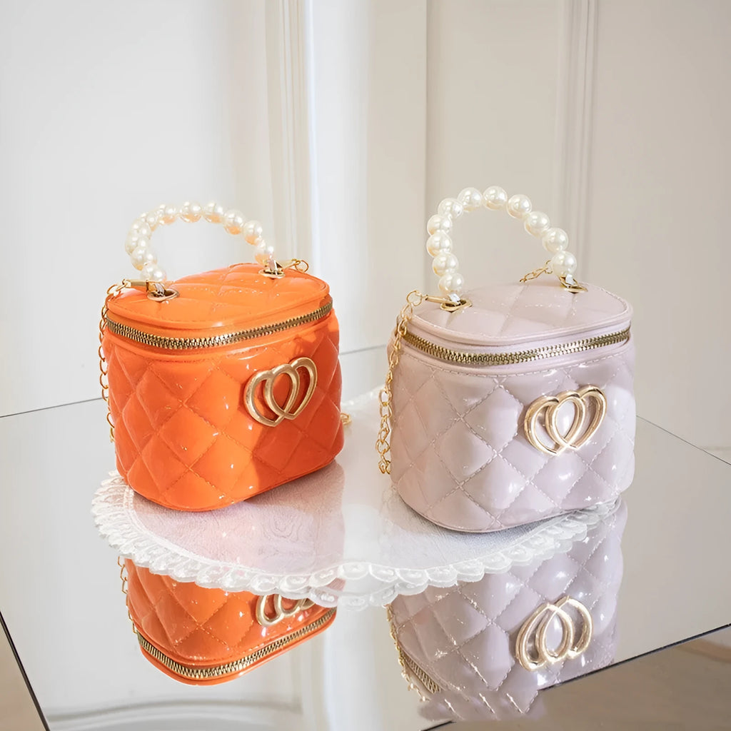 White PVC bucket handbag with a heart-shaped pattern