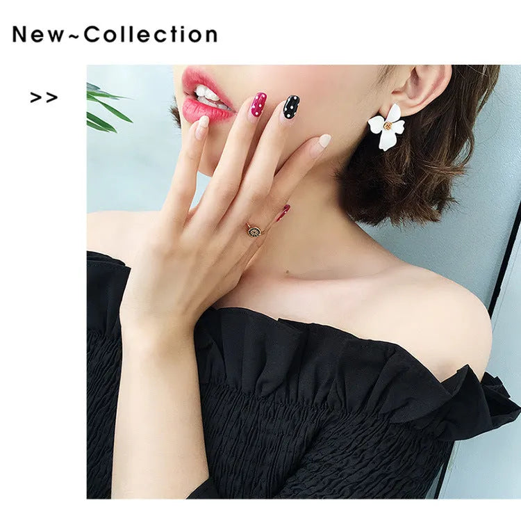 A pair of floral-shaped stud earrings for women, shown in alloy with an electroplated finish in white or pink colour.