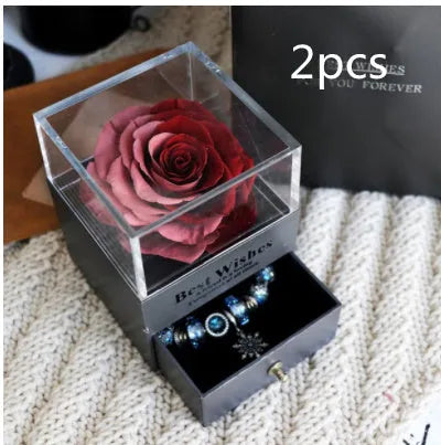 Eternal flower gift box with preserved roses and carnations measuring 8.5 cm square by 10.5 cm high