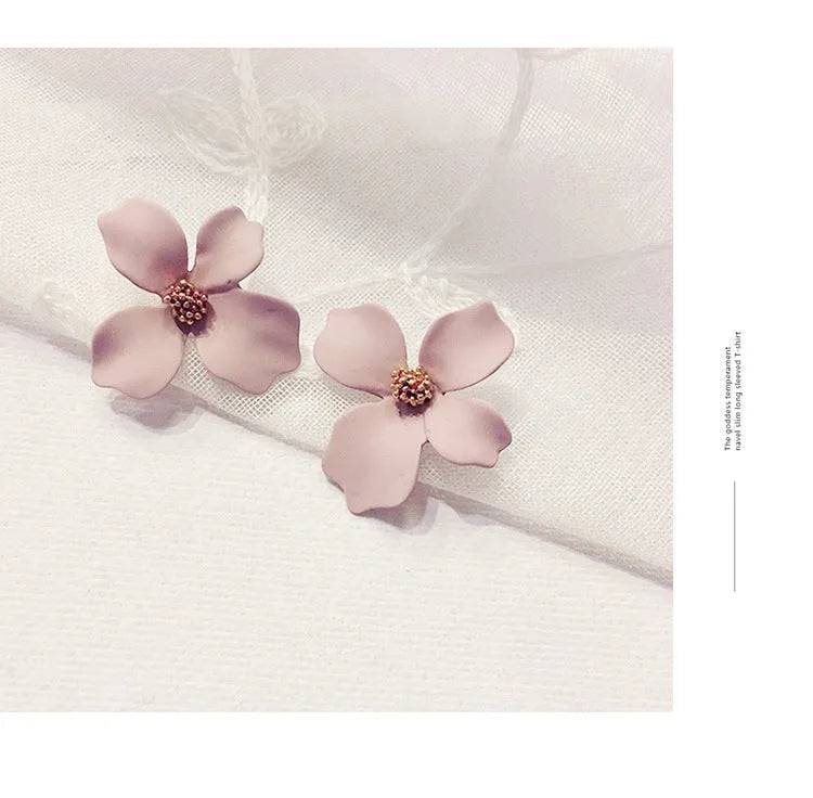 A pair of floral-shaped stud earrings for women, shown in alloy with an electroplated finish in white or pink colour.