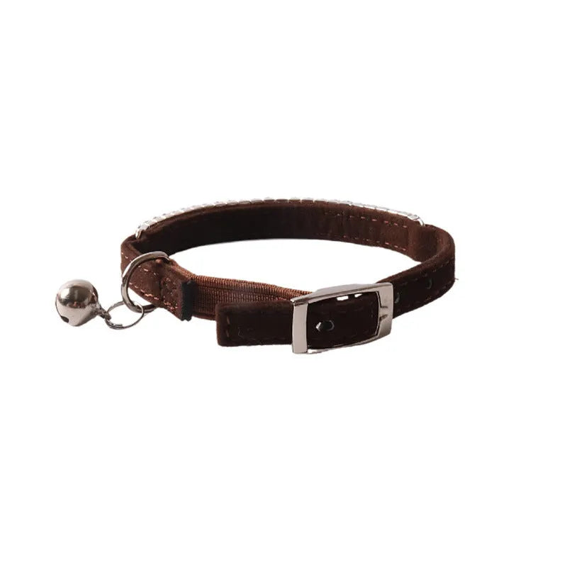 Soft flocking elastic buckle cat collar in multiple colours on a white background.