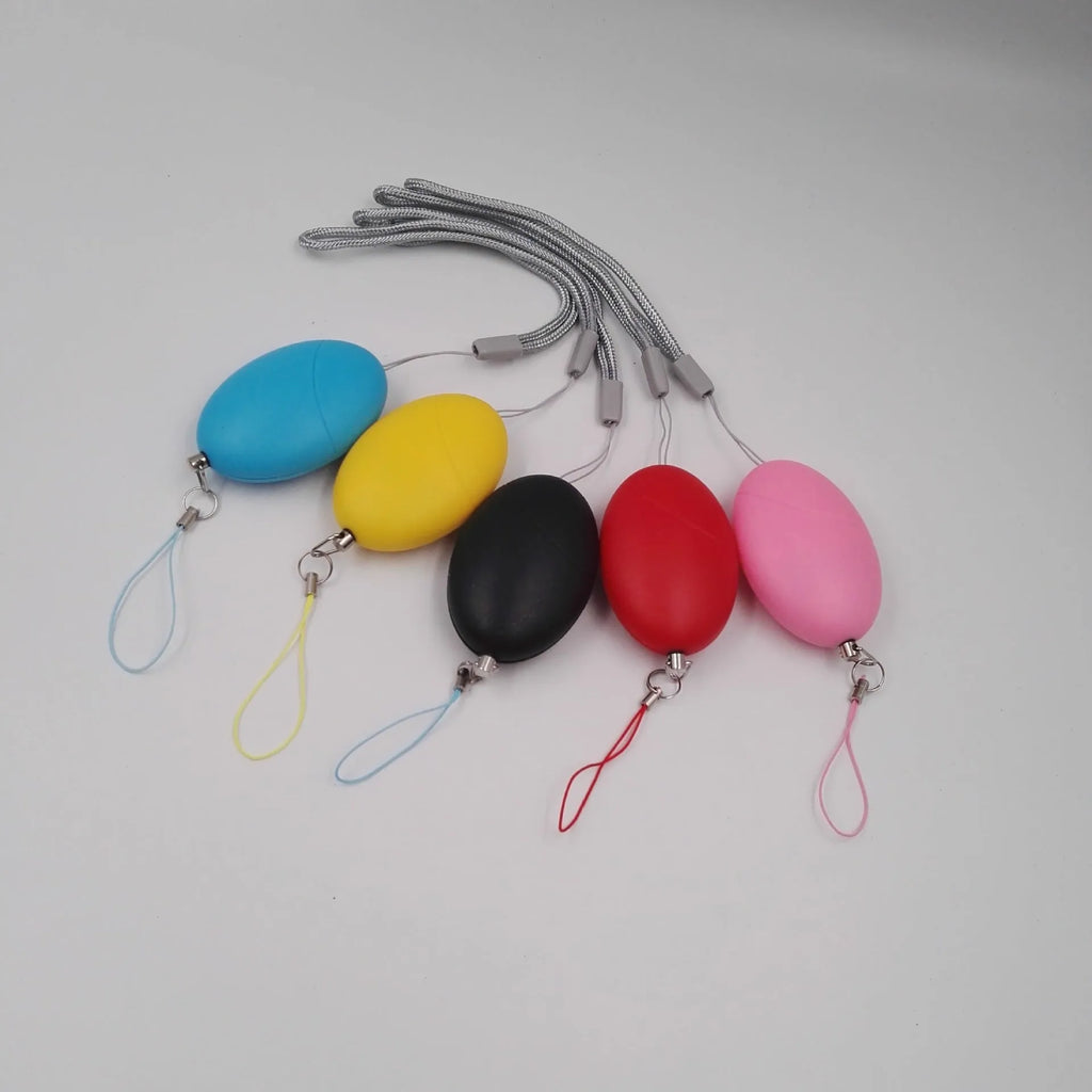 Oval personal alarm in black, blue, pink, red or yellow, 120dB wolf guard anti-tracking keyring alarm for women, elderly and children.