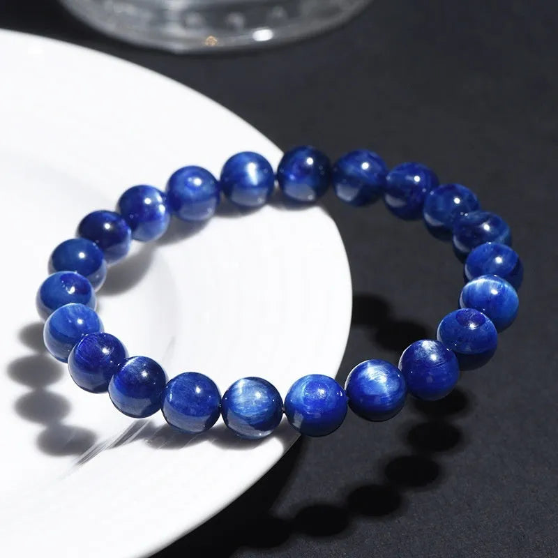 Blue crystal ball bracelet with geometric beads and Ruyi design elements on wrist