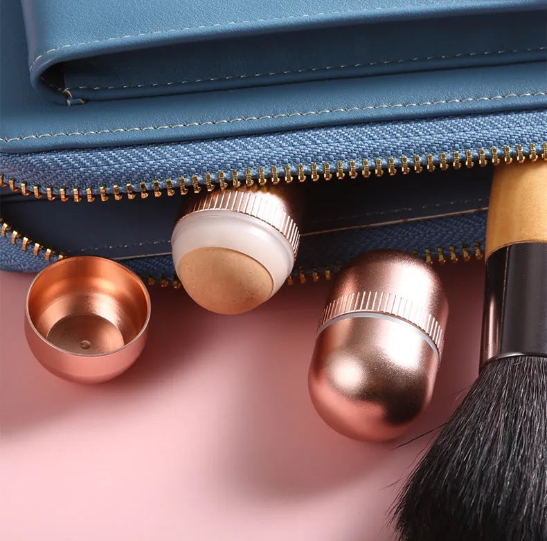 Volcanic stone oil absorbing roller with aluminium alloy and plastic handle for facial oil control, shown in black, pink, or red.