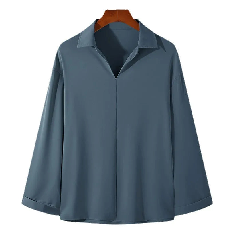 Men's loose lapels casual long sleeve shirt in a solid colour on a hanger.