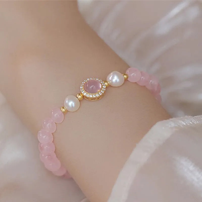 Women's aquamarine crystal bracelet set with pink beads and mixed materials in dopamine colours