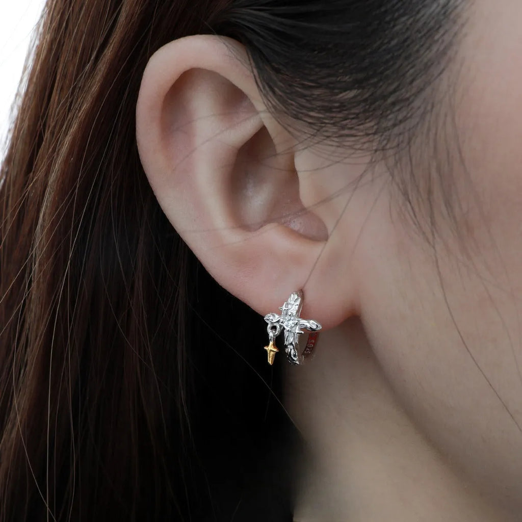 Pair of 925 sterling silver geometric cross earrings with a white gold colour electroplated finish.