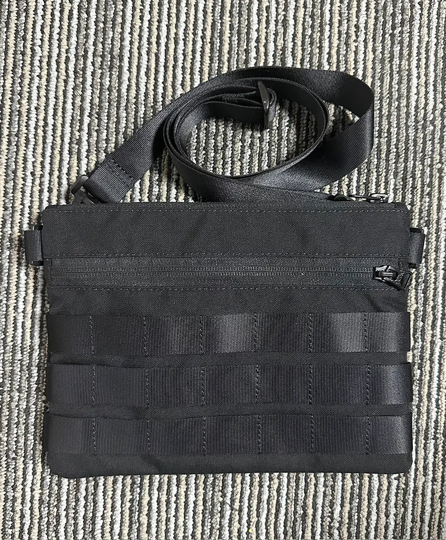 Black multifunctional outdoor kit made of Oxford cloth, measuring 18cm x 3.5cm, designed for military and camping use.