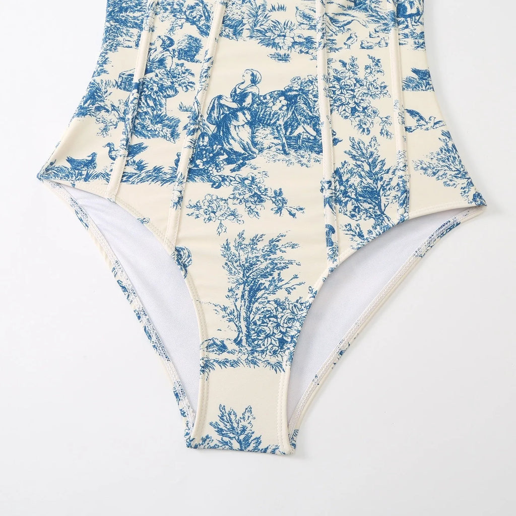 Blue women's one-piece swimsuit with matching gauze skirt accessory on mannequin