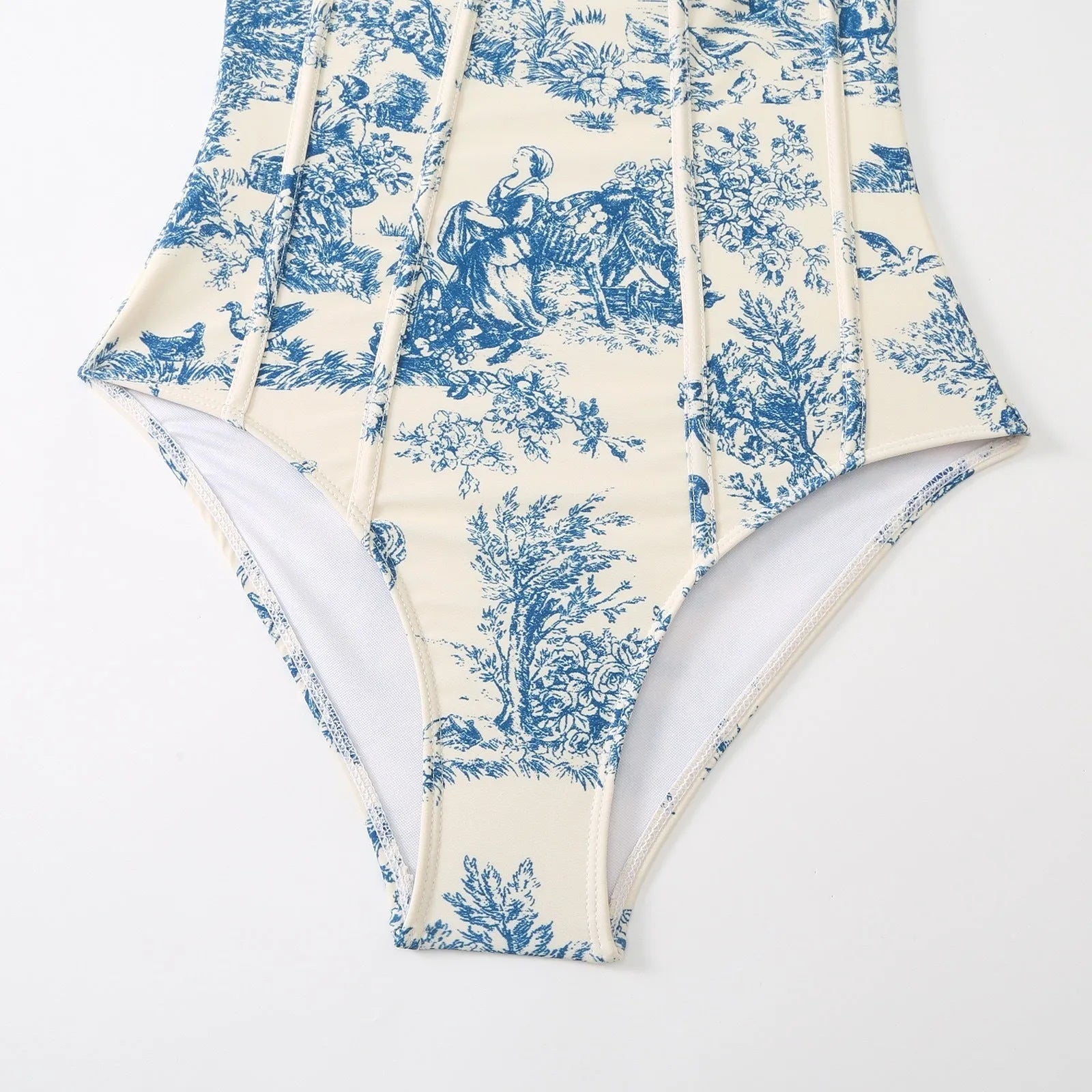 Blue women's one-piece swimsuit with matching gauze skirt accessory on mannequin