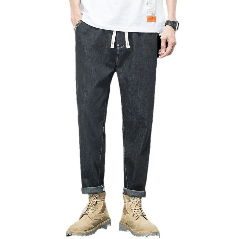 Men's loose fit plus size jeans with elastic mid waist, thin cotton denim, blue or black, sizes L to 7XL