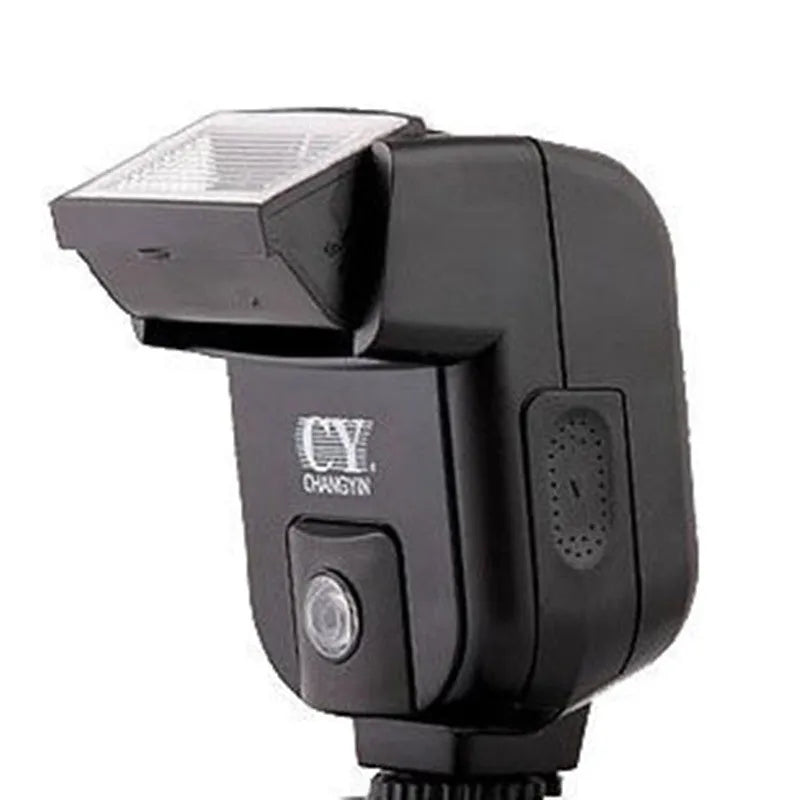 Compact black hot shoe flash unit tilted upwards on a DSLR camera