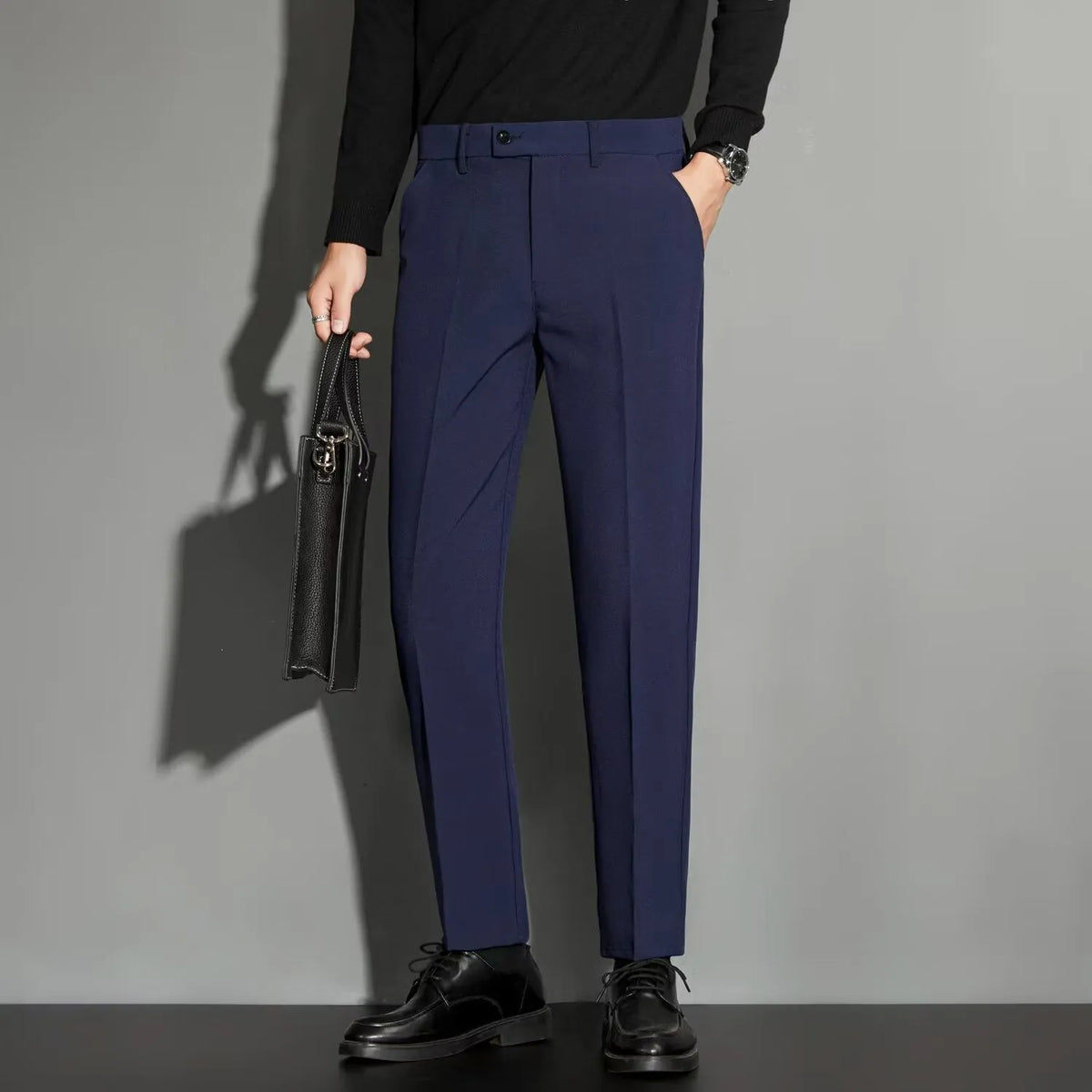 Men's straight leg suit trousers in chemical fibre blend fabric showing spring draping effect