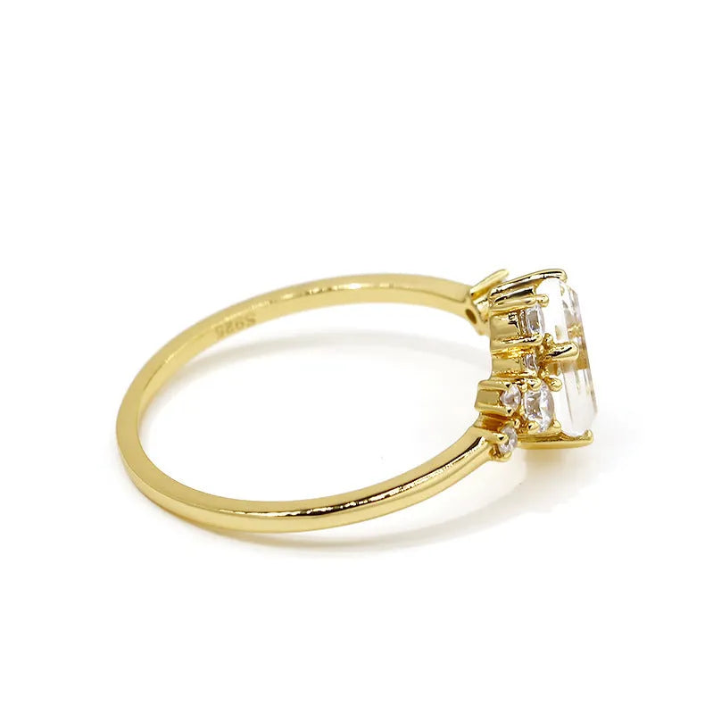 White crystal shiny electroplated silver women's ring on a white background