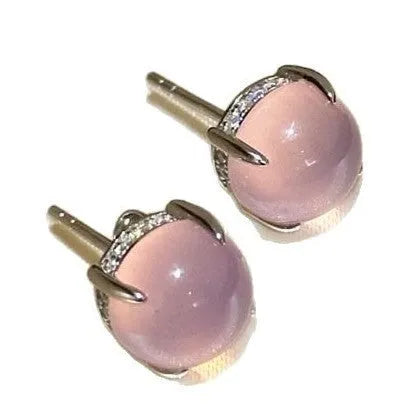 A pair of Chinese-style retro stud earrings with a round egg-shaped chalcedony stone in a four-claw copper setting.