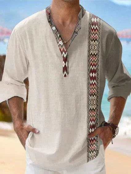 Man wearing a thin striped long sleeve casual shirt in cardigan style.
