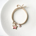 Green cartoon star hair ring with baking varnish finish on white background