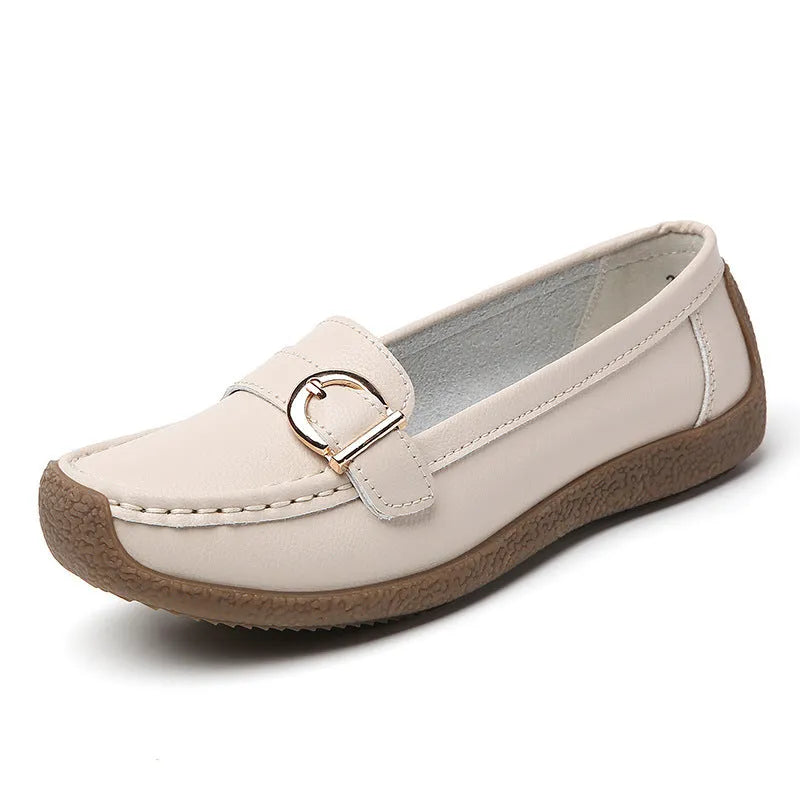 Women's beige casual flat loafers with round toe and slip-on design on a soft sole.
