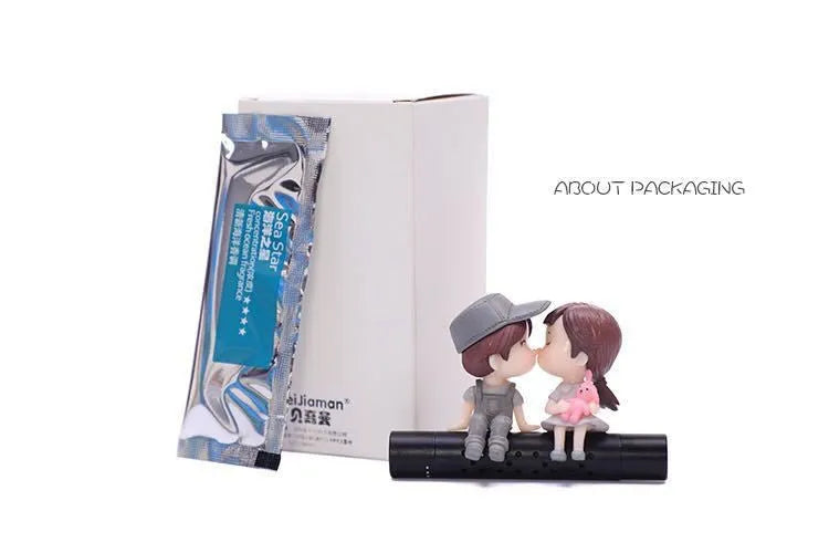 Cartoon couple car air outlet perfume clip in PVC and metal with included aroma stick, grey or blue option