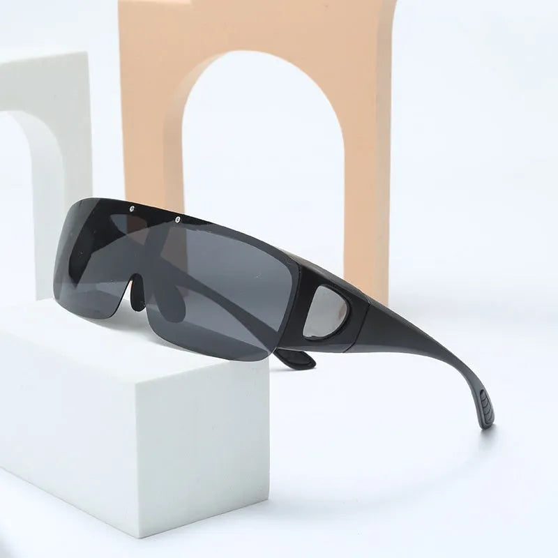Pair of polarised myopia sunglasses with a one-piece frame, shown with dark lenses for outdoor sports use.