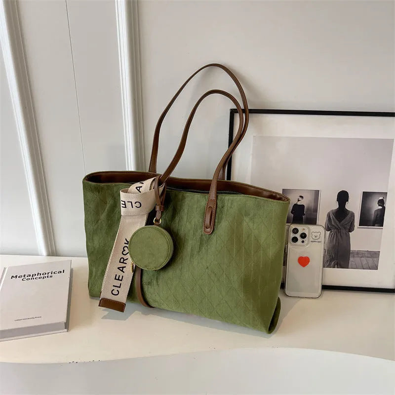Large casual shoulder bag in horizontal square shape with sandwich pocket design and zip internal compartment