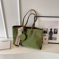 Large casual shoulder bag in horizontal square shape with sandwich pocket design and zip internal compartment
