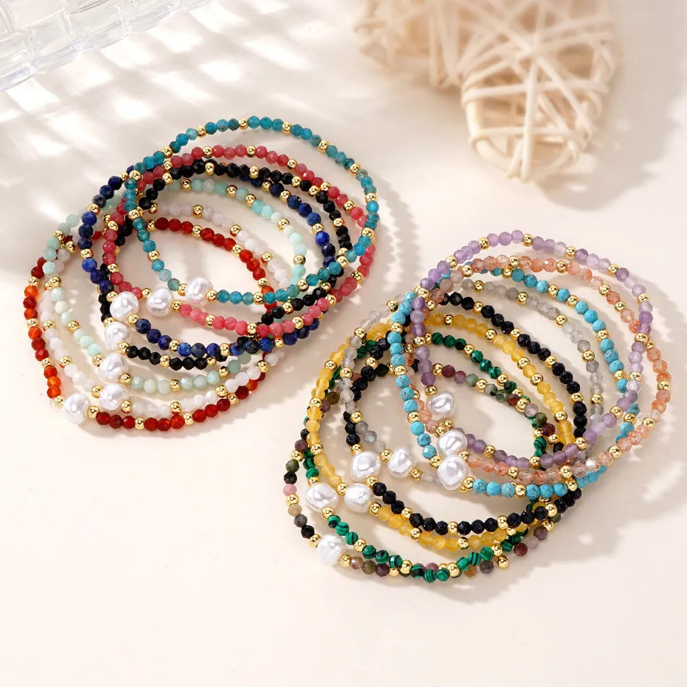A natural stone bracelet with a geometric ellipse shape on a wrist.