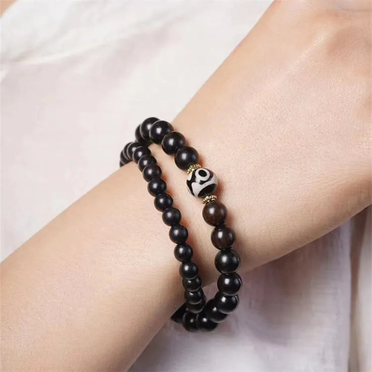 Ebony wood bracelet with 8mm diameter and two circles of beads in retro style