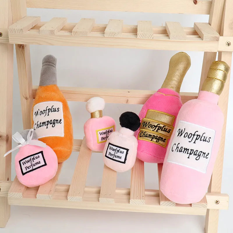 Soft plush pet toy in the shape of a wine bottle, shown in multiple colour options.