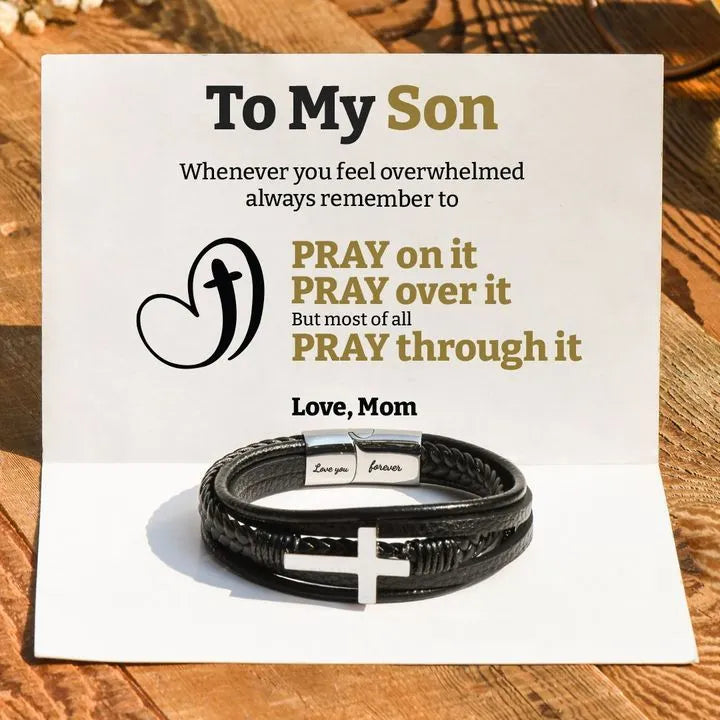 Men's stainless steel cross bracelet with leather band and plated finish, shown in steel and black colour options
