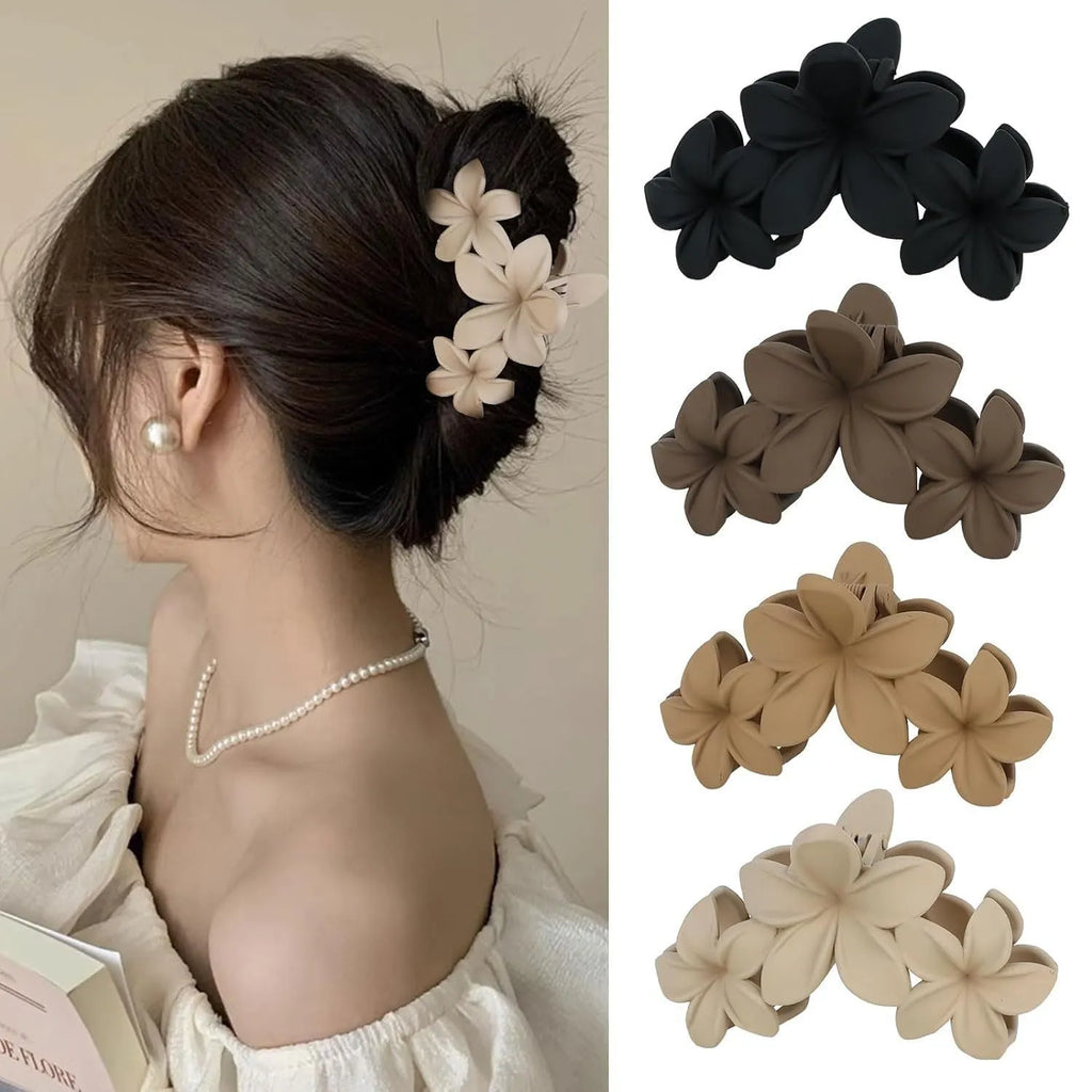 Six rose red and nude plastic hair clips with frosted grips and a quadrilateral shape.
